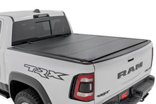 Load image into Gallery viewer, Rough Country Hard Tri-Fold Flip-Up Bed Cover Ram 1500 (19-26) / 1500 TRX (21-24)