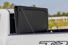Load image into Gallery viewer, Rough Country Hard Tri-Fold Flip-Up Bed Cover Ram 1500 (19-26) / 1500 TRX (21-24)